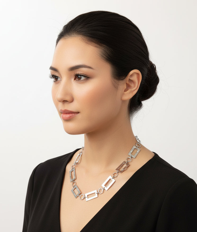 Necklace displayed on a mannequin bust against a plain background