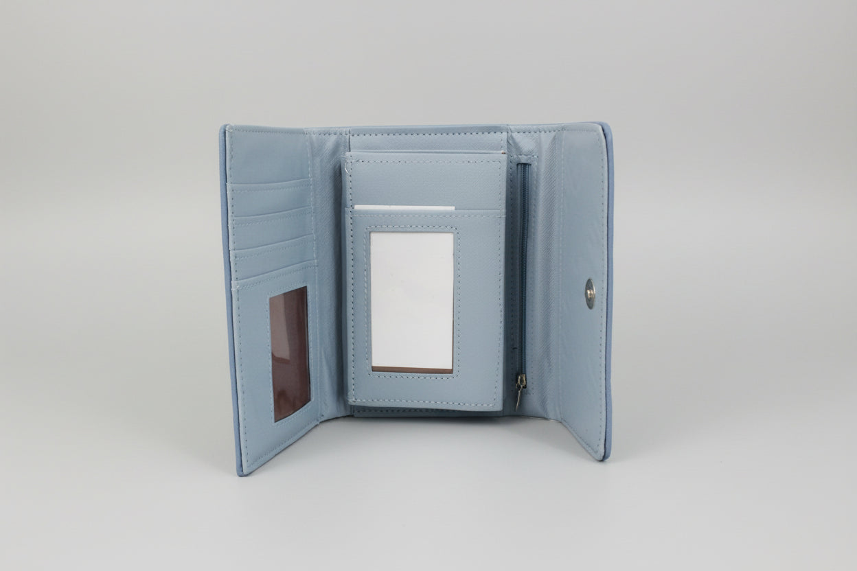 Blue wallet with a card holder on a white surface