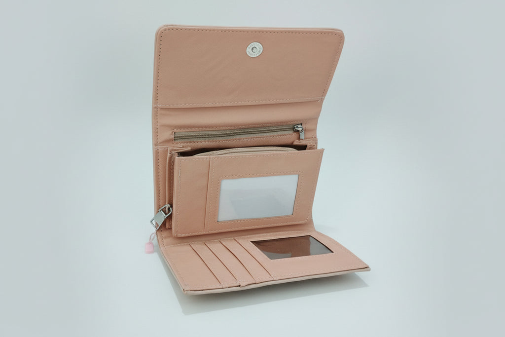 pink wallet opened in white backround