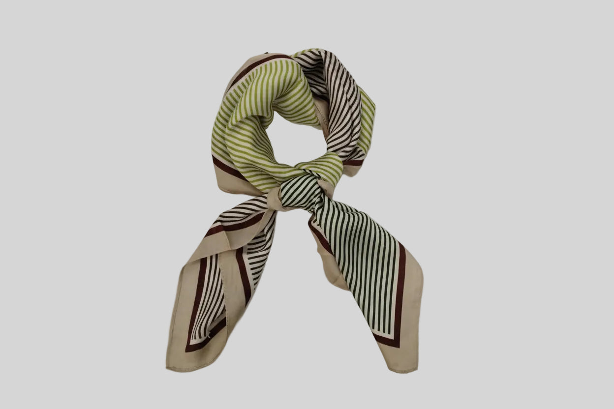 Striped scarf with geometric pattern on a white surface
